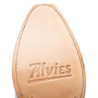 Close-up of the tan leather sole on The Trinity boot in white, stamped with Alvies logo