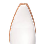 Close-up of the pointed toe on The Trinity boot in white leather with tan trim stitching