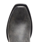 Close-up of The Shoal Creek's weathered black square toe and stitching