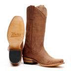 The Shoal Creek tan pair with one boot tipped to show the Alvies-stamped sole
