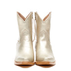 Close-up of the pointed toe on The Trinity boot in metallic champagne leather