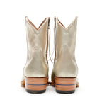 Close-up of the tan sole on The Trinity boot in champagne, stamped with Alvies logo