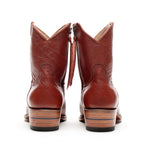 Back view of The Trinity ankle boots in cognac-brown leather showing the zip pulls