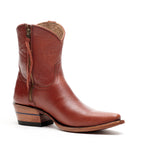 Side profile of a single Trinity ankle boot in cognac-brown leather with its zipper