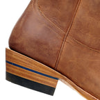 Close-up of The Shoal Creek tan boot heel with the blue heel stripe detail