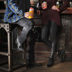 Bar scene, man and woman standing, The 6th Street black boots on the floor.