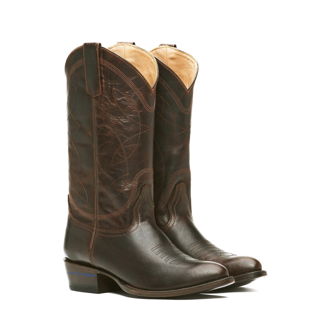 Studio pair of The Lamar boots in Whiskey River brown leather, tan interior visible.